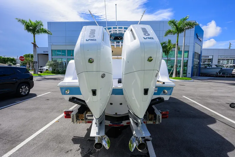 Slide: The Image of 2026 Sportsman Open 302 Center Console with dual outboard engines in a dealership lot. - 2