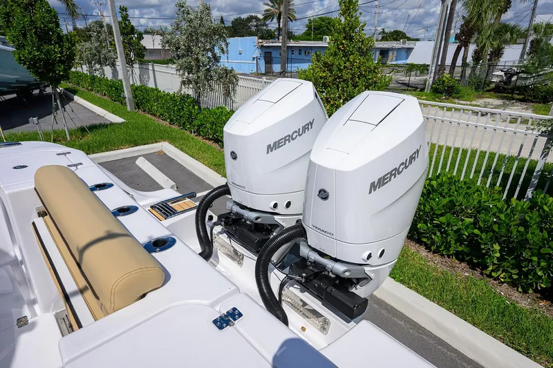 Slide: The Image of 2026 Sportsman Open 302 Center Console with dual Mercury outboard engines. - 22