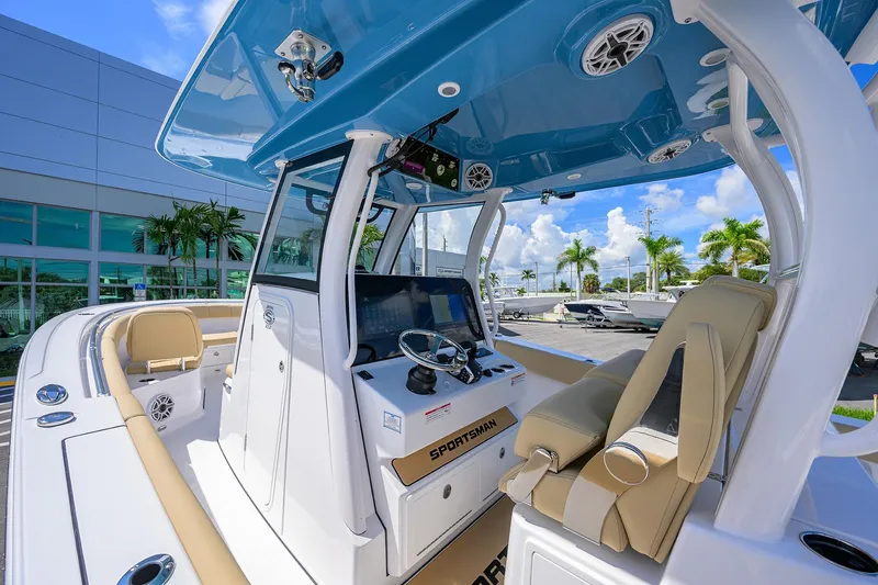 Slide: The Image of 2026 Sportsman Open 302 Center Console boat interior with modern helm and seating. - 24