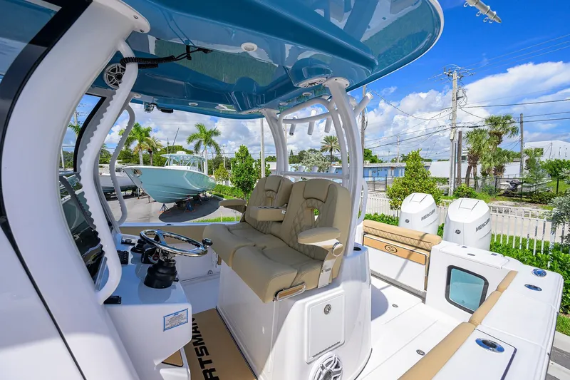 Slide: The Image of 2026 Sportsman Open 302 Center Console boat with dual seats and modern helm. - 25