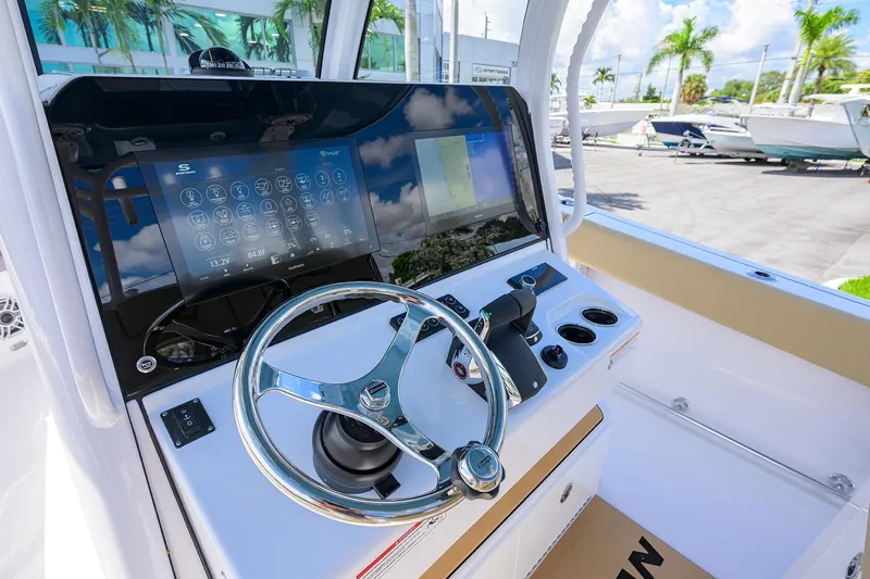 Slide: The Image of 2026 Sportsman Open 302 Center Console with advanced touchscreen and steering wheel. - 27