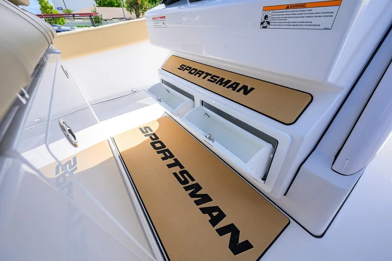 Slide: The Image of 2026 Sportsman Open 302 Center Console boat interior with branded storage compartments. - 29