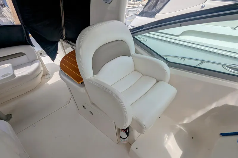 Slide: The Image of Luxury seating on 2004 Sea Ray 340 Sundancer yacht, featuring white leather upholstery. - 12