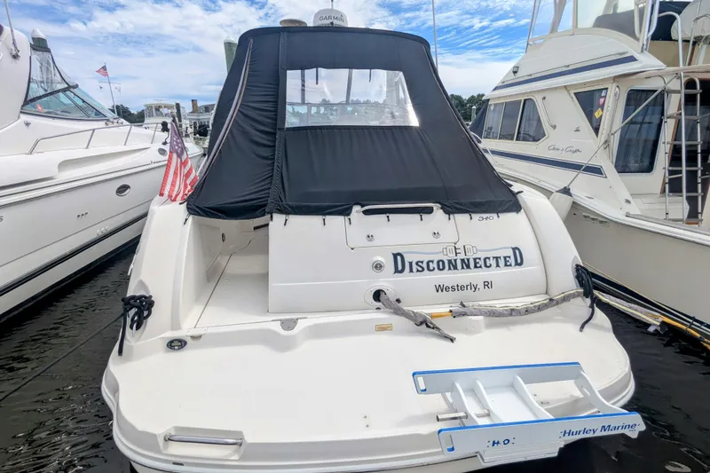 Slide: The Image of 2004 Sea Ray 340 Sundancer docked, featuring "Disconnected" name and Westerly, RI location. - 18