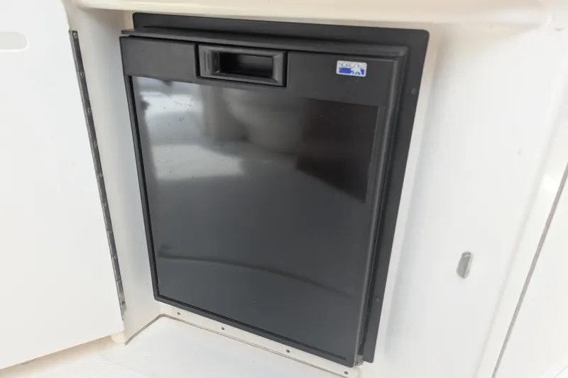 Slide: The Image of Built-in refrigerator on a 2004 Sea Ray 340 Sundancer boat. - 19