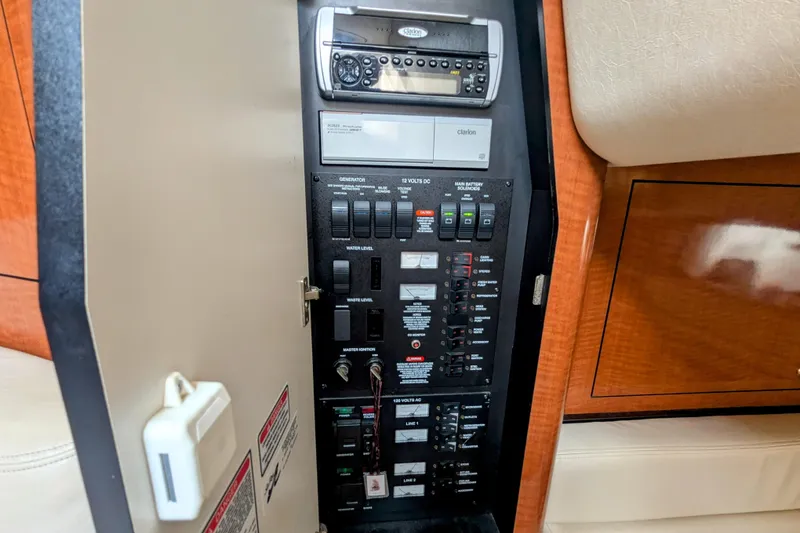 Slide: The Image of 2004 Sea Ray 340 Sundancer control panel with Clarion stereo system. - 29