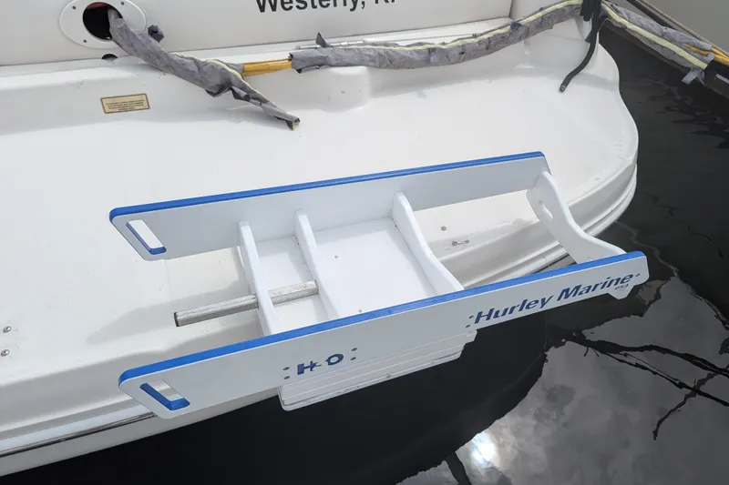 Slide: The Image of 2004 Sea Ray 340 Sundancer with Hurley Marine davit system on swim platform. - 31