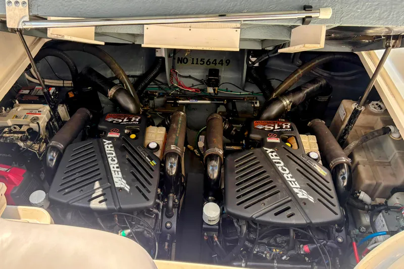 Slide: The Image of Engine compartment of a 2004 Sea Ray 340 Sundancer with twin Mercury engines. - 32
