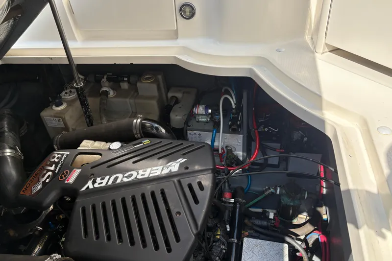 Slide: The Image of Engine compartment of 2004 Sea Ray 340 Sundancer with Mercury engine components. - 33