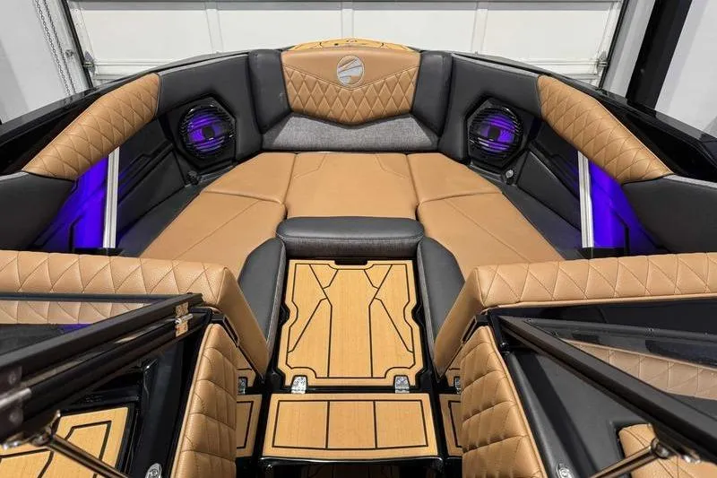 Slide: The Image of Luxurious interior of 2026 Tigé Z3 boat with tan upholstery and ambient lighting. - 13