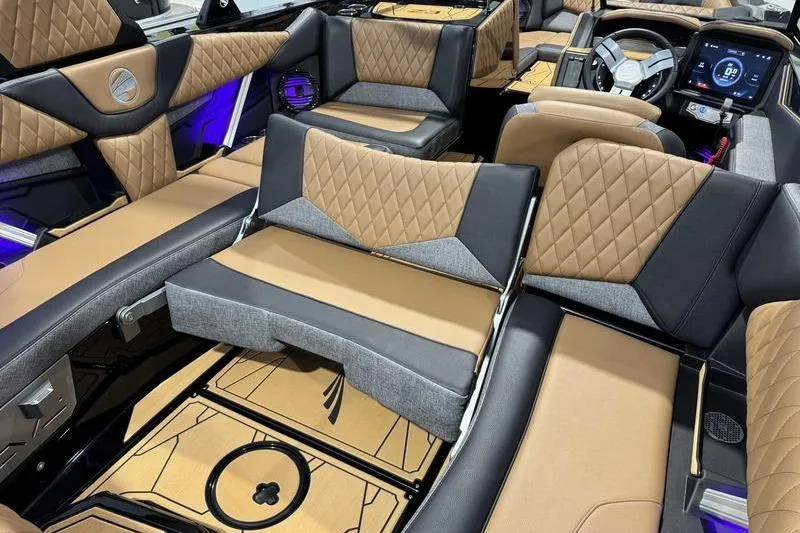 Slide: The Image of Luxurious interior of 2026 Tigé Z3 boat with diamond-stitched seats and modern dashboard. - 14