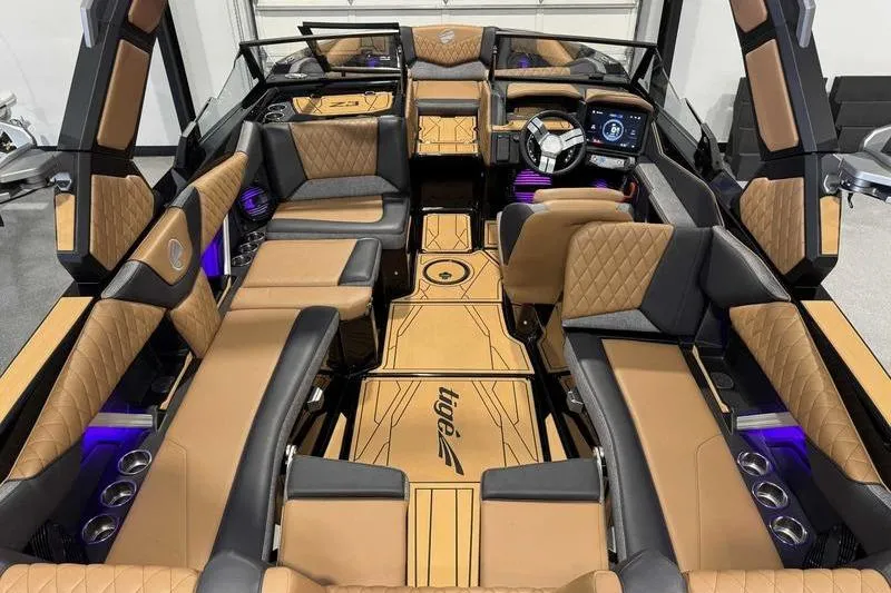 Slide: The Image of Luxurious interior of 2026 Tigé Z3 boat with plush seating and modern dashboard. - 15