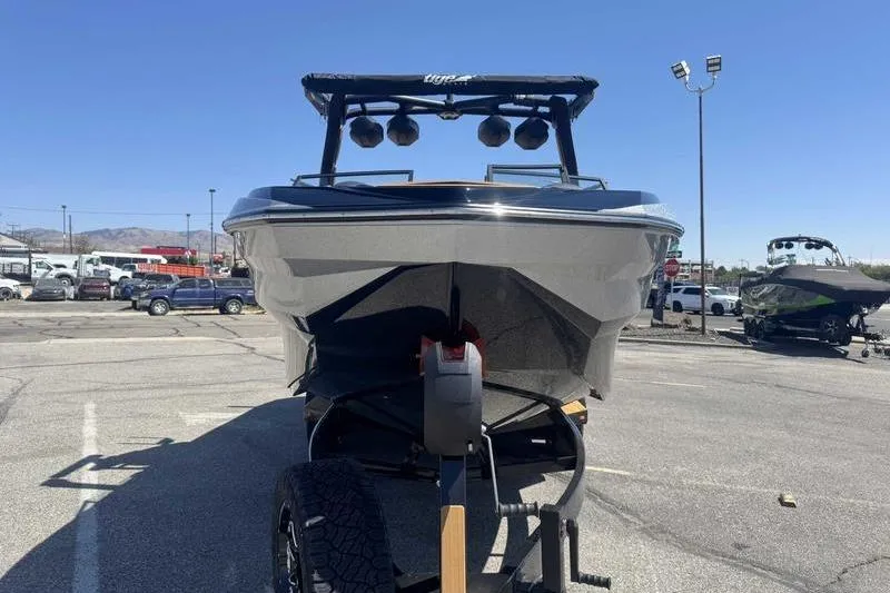 Slide: The Image of 2026 Tigé Z3 engine cover with textured design and warning label. - 3