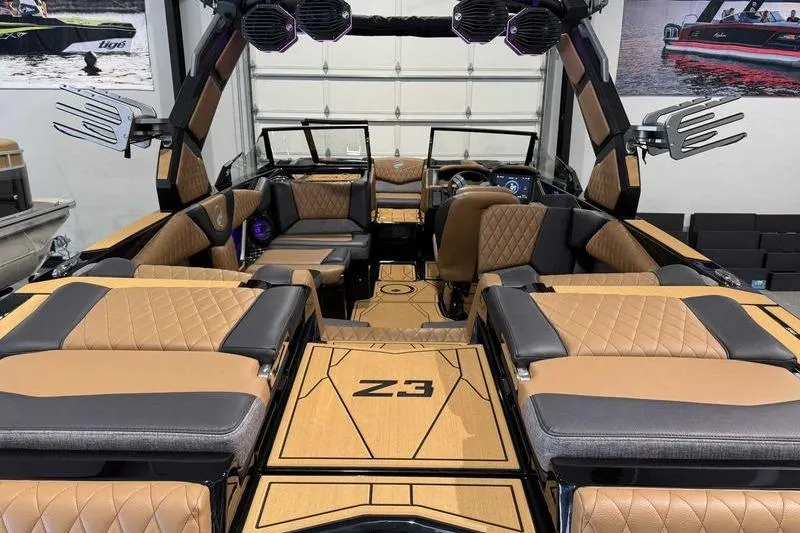 Slide: The Image of 2026 Tigé Z3 boat on trailer in parking lot, side view. - 6