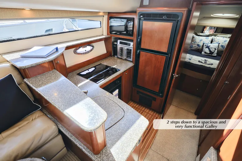 Slide: The Image of 2005 Meridian 459 Aft Cabin Motor Yacht interior with modern galley and cozy cabin. - 21