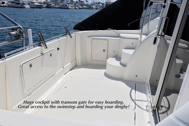 Slide: The Image of 2005 Meridian 459 Aft cabin motor yacht cockpit with transom gate and swimstep access. - 4