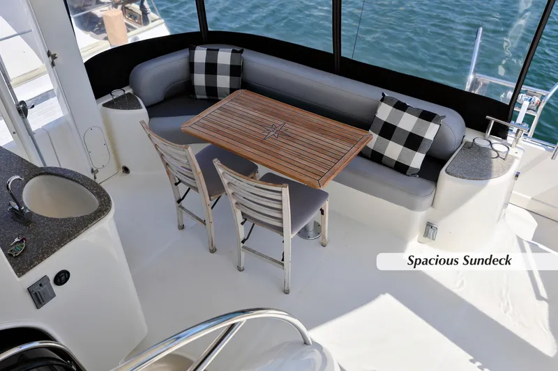 Slide: The Image of 2005 Meridian 459 Aft Cabin Motor Yacht with spacious sundeck and elegant seating area. - 8
