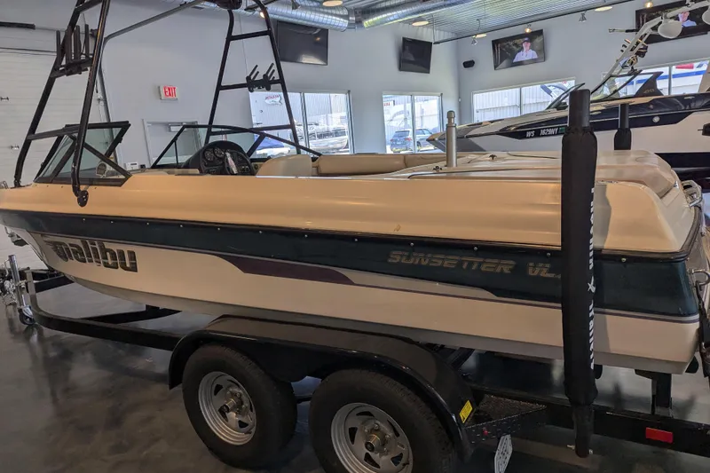 Slide: The Image of 2000 Malibu Sunsetter VLX boat on trailer in showroom. - 5