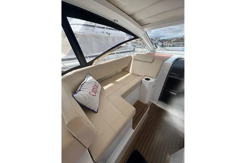 Slide: The Image of 2017 Cruisers Yachts 39 Express Coupe interior with helm and seating area. - 20