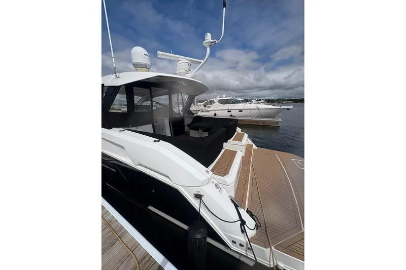 Slide: The Image of 2017 Cruisers Yachts 39 Express Coupe interior with kitchenette and welcome mat. - 15