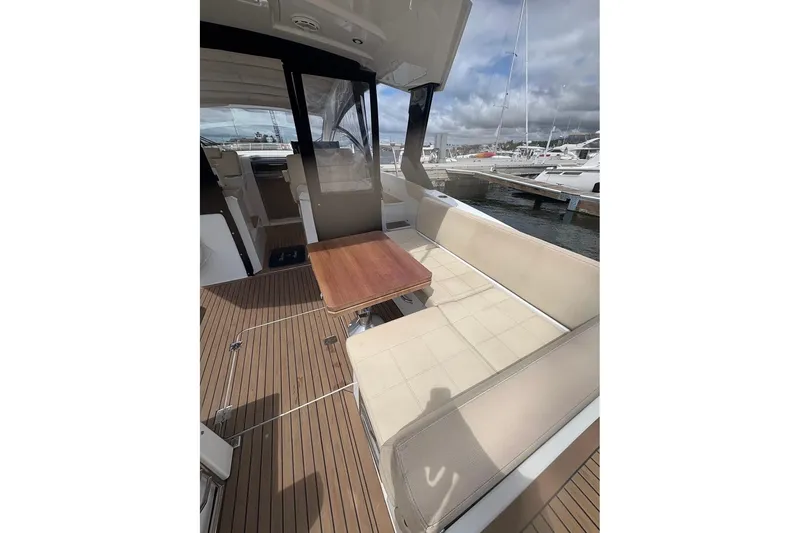 Slide: The Image of 2017 Cruisers Yachts 39 Express Coupe cockpit with steering wheel and navigation screens. - 18