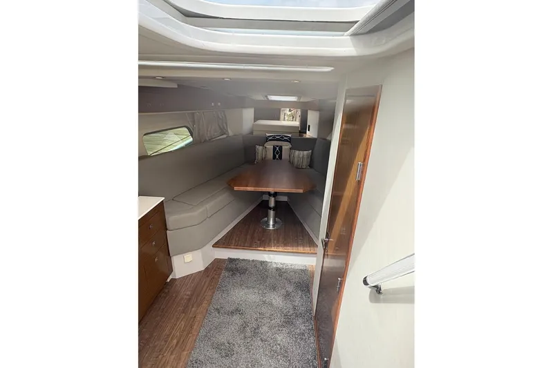 Slide: The Image of 2017 Cruisers Yachts 39 Express Coupe kitchen with modern appliances and wood cabinetry. - 29