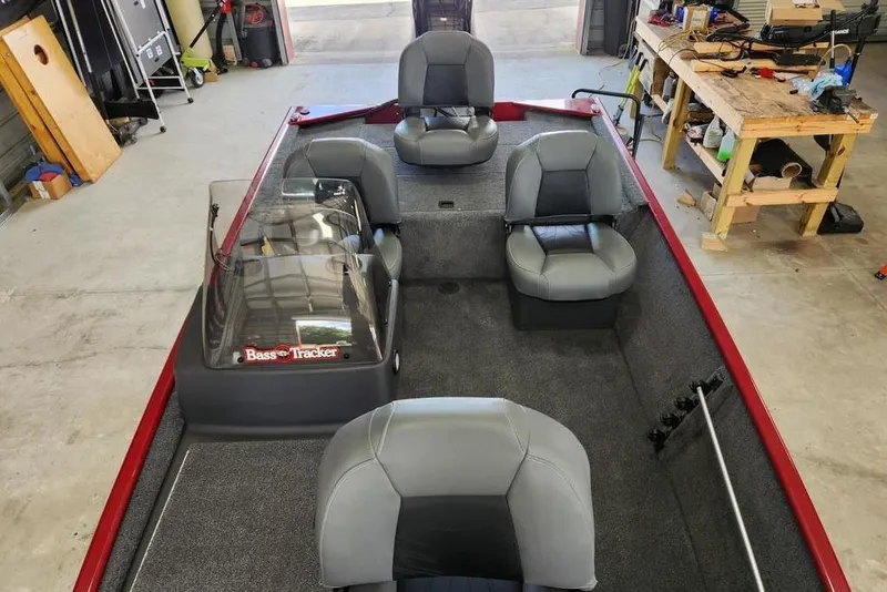 Slide: The Image of 2026 Tracker BASS TRACKER® Classic XL boat interior with seating and steering console. - 11