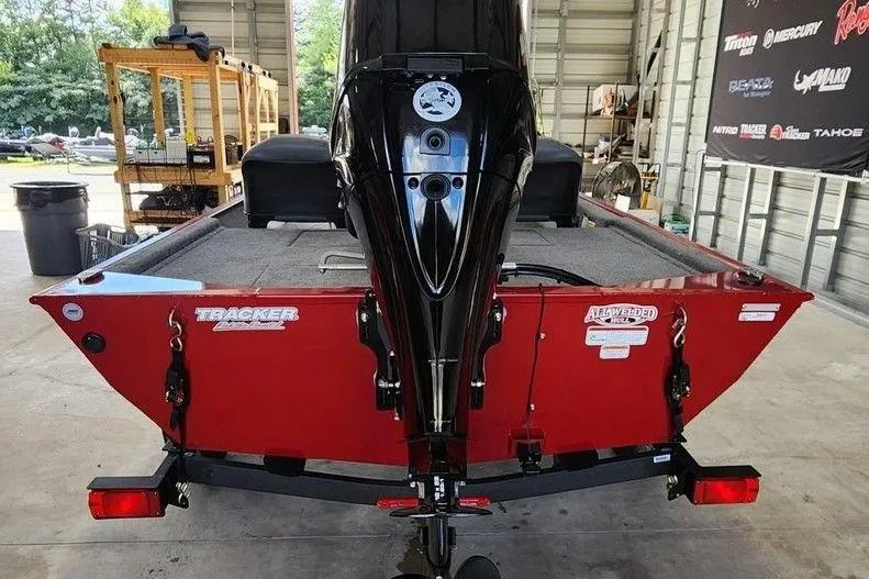 Slide: The Image of 2026 Tracker BASS TRACKER® Classic XL boat in a garage, rear view. - 5
