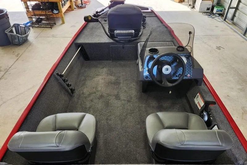 Slide: The Image of 2026 Tracker BASS TRACKER® Classic XL boat interior with steering console and seating. - 7