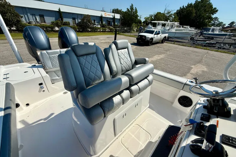 Slide: The Image of 2022 Blue Wave 2800 Makaira boat with luxurious seating and modern controls. - 10