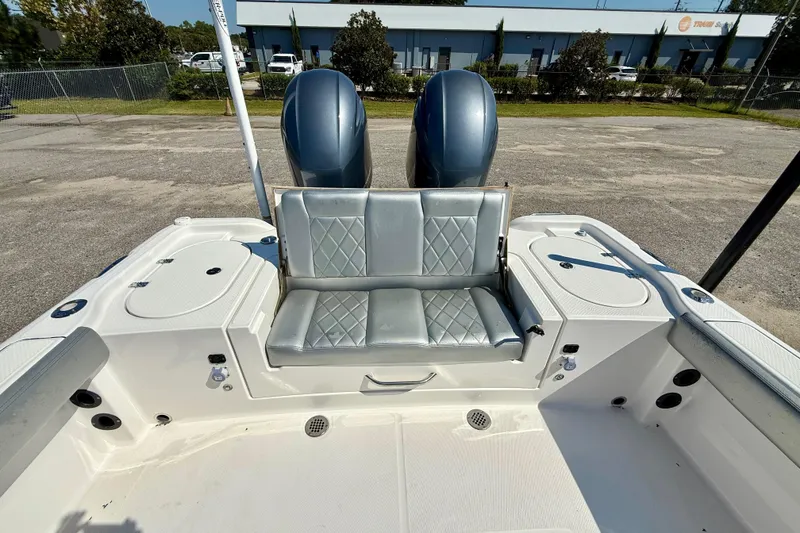 Slide: The Image of 2022 Blue Wave 2800 Makaira boat with dual engines and cushioned seating. - 11