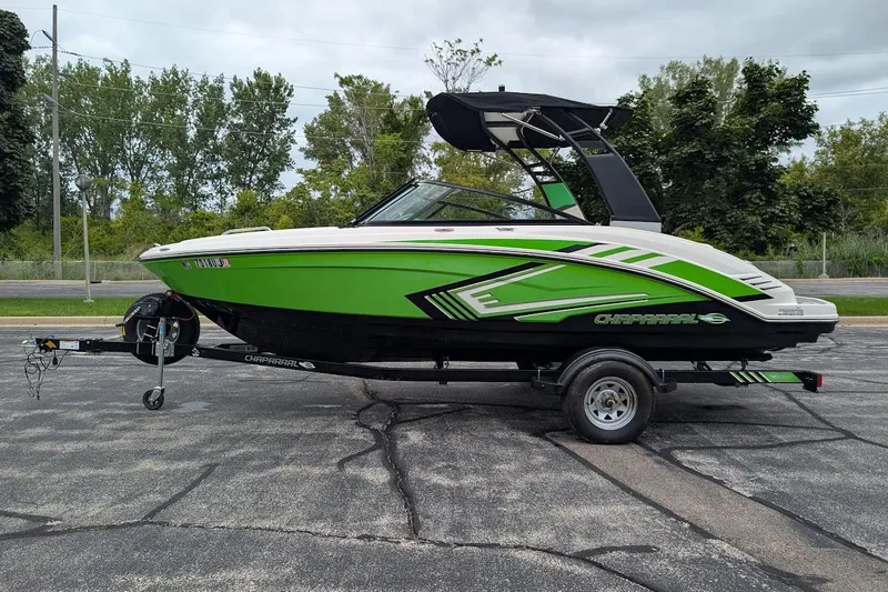 The Image of 2018 Chaparral Vortex 203 VRX boat on trailer, green and black design. - 0