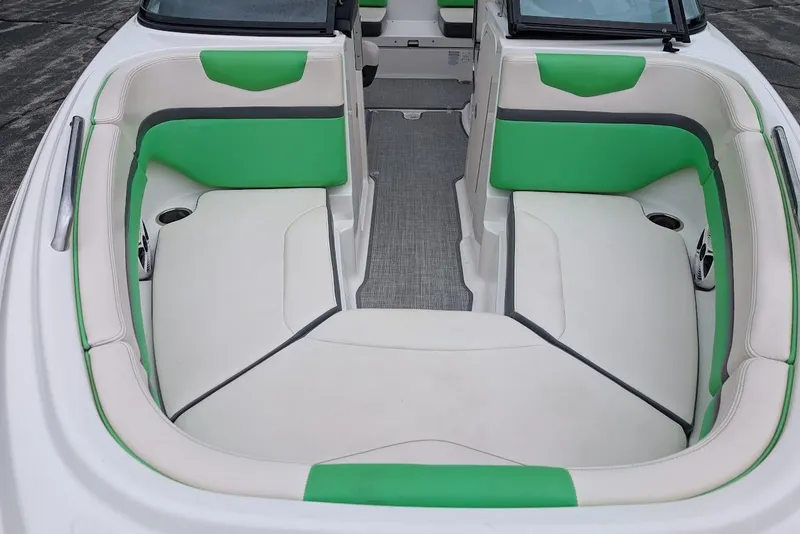 Slide: The Image of 2018 Chaparral Vortex 203 VRX boat interior with green and white seating. - 10