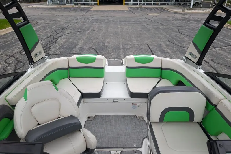 Slide: The Image of 2018 Chaparral Vortex 203 VRX boat interior with green and white seating. - 16