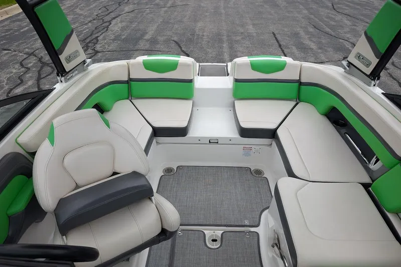 Slide: The Image of 2018 Chaparral Vortex 203 VRX boat interior with green and white seating. - 17