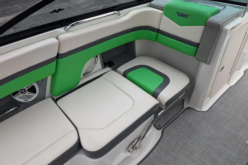 Slide: The Image of 2018 Chaparral Vortex 203 VRX boat interior with green and white seating. - 23