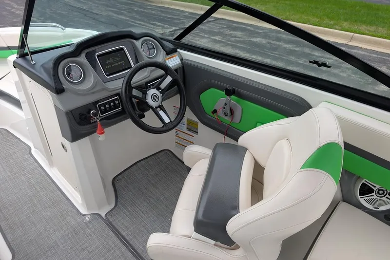 Slide: The Image of 2018 Chaparral Vortex 203 VRX boat interior with steering wheel and seating. - 26