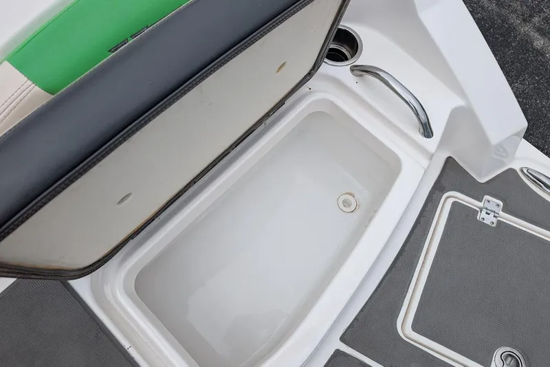 Slide: The Image of 2018 Chaparral Vortex 203 VRX boat storage compartment with open lid. - 31
