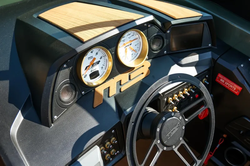 Slide: The Image of Dashboard of 2022 MB B52 23 Alpha boat with gauges and steering wheel. - 11