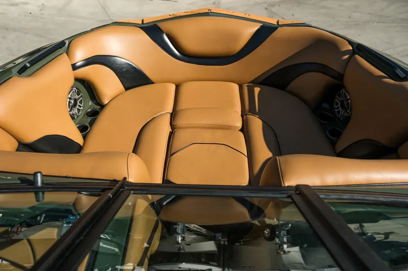 Slide: The Image of Luxurious interior of 2022 MB B52 23 Alpha boat with tan and black seating. - 12