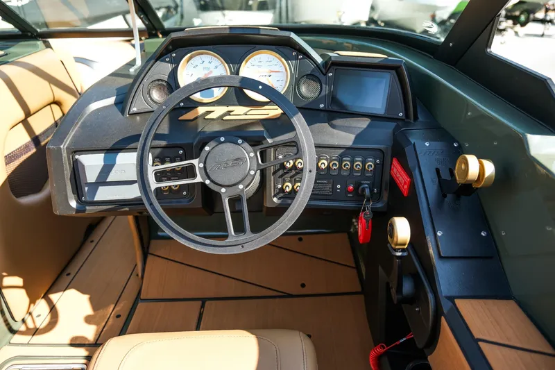 Slide: The Image of 2022 MB B52 23 Alpha boat dashboard with steering wheel and control panel. - 17