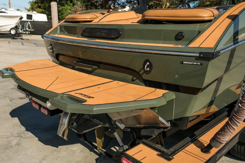 Slide: The Image of 2022 MB B52 23 Alpha boat with sleek design and wooden deck details. - 20