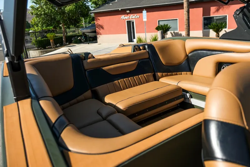 Slide: The Image of Luxurious interior of 2022 MB B52 23 Alpha boat with tan and black seating. - 6