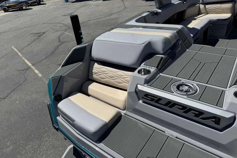 Slide: The Image of 2026 Supra SA boat interior with cushioned seating and sleek design. - 6