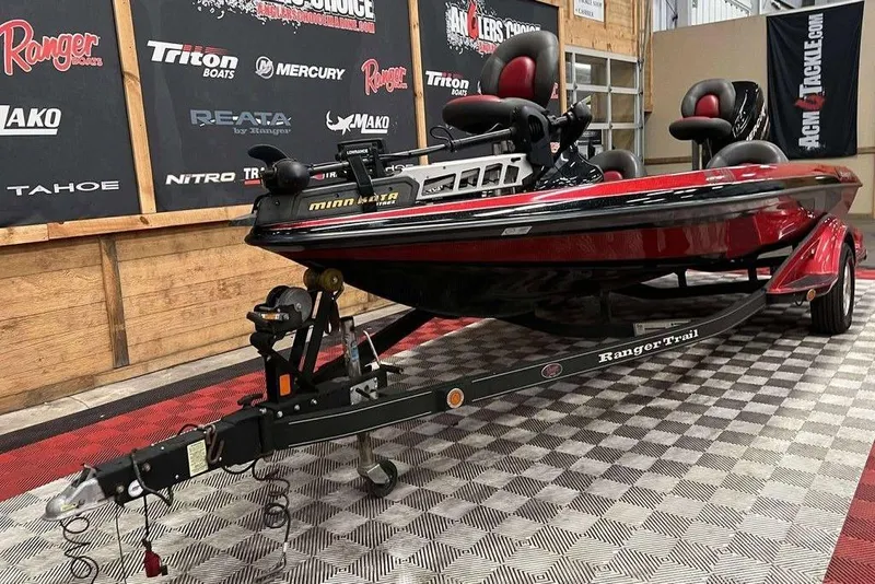 Slide: The Image of 2008 Ranger 188VX Comanche boat on trailer in showroom with branded banners. - 5