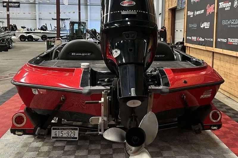 Slide: The Image of 2008 Ranger 188VX Comanche boat with outboard motor in a showroom. - 8