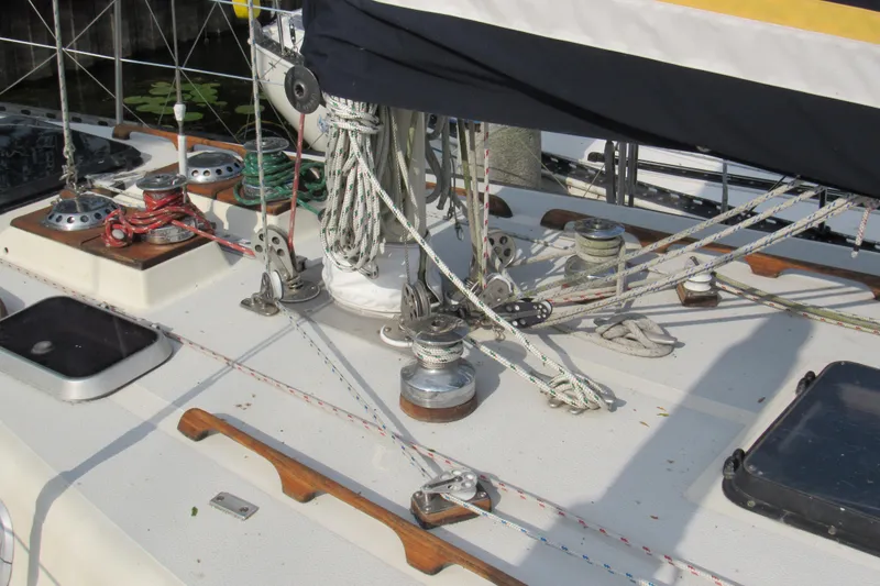 Slide: The Image of Deck of 1976 Tartan 3800 sailboat with ropes and winches. - 13
