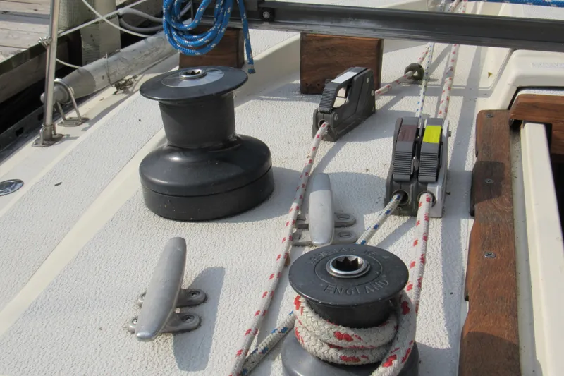 Slide: The Image of Deck of 1976 Tartan 3800 sailboat with winches and ropes. - 18