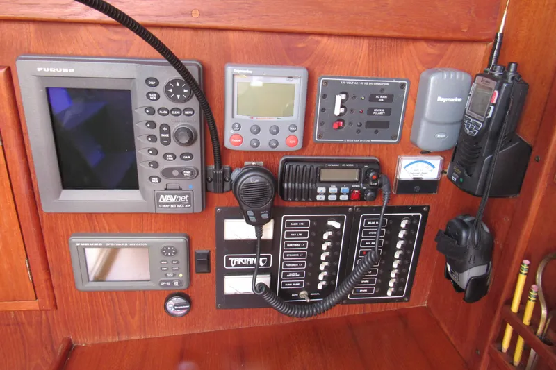 Slide: The Image of Control panel of a 1976 Tartan 3800 sailboat with navigation and communication equipment. - 8