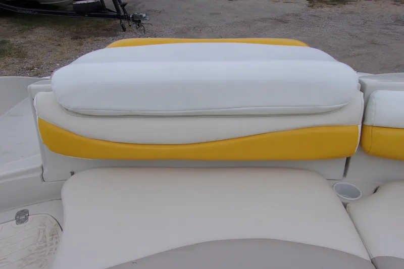 Slide: The Image of 2009 Tahoe 195 I/O boat seat with white and yellow upholstery. - 13